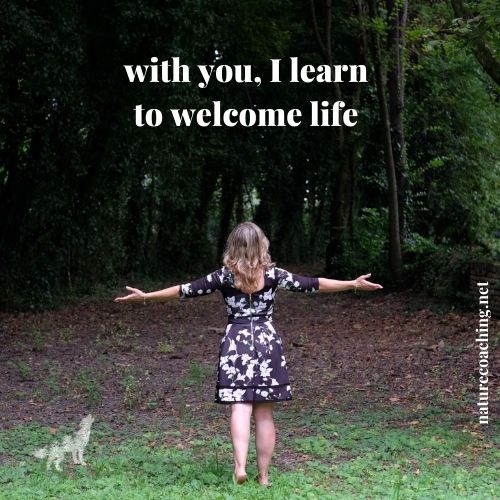 silvia opening arms to a forest